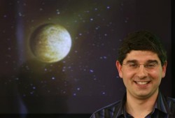 Ignasi Ribas with simulated picture of the new planet.  Image Credit:  REUTERS/Sergio Perez