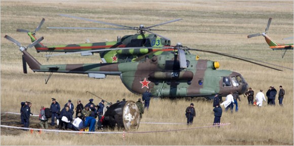 Rescue helicopters next to the askew Soyuz on Saturday (Shamil Zhumatov)