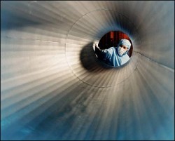 A scientist cleans a vacuum spatial filter for the Vulcan Petawatt Facility during construction (Rutherford Appleton Laboratory)