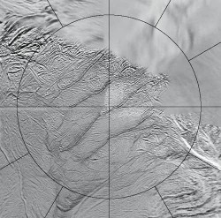 The four long fissures straddle the south pole of Enceladus and run for more than 100 kilometres – the circular grid marks 60° South (NASA)