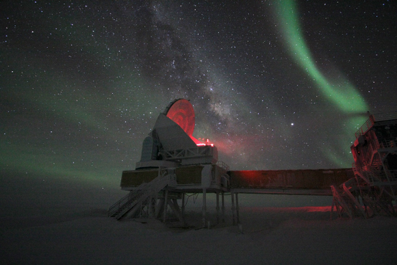 The South Pole Telescope under the aurora australis (southern lights).  Photo by Keith Vanderlinde