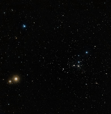 A wide-field image of the region around the Coma galaxy cluster (Abell 1656) constructed from the images in the Digitized Sky Survey. NGC 4921 is the largest galaxy to the left, and slightly below, the pair of galaxies at the centre of the image. The field-of-view is approximately 2.7 x 2.85 degrees. Credits: NASA, ESA, and the Digitized Sky Survey 2. Acknowledgment: Davide De Martin (ESA/Hubble) A wide-field image of the region around the Coma galaxy cluster (Abell 1656) constructed from the images in the Digitized Sky Survey. NGC 4921 is the largest galaxy to the left, and slightly below, the pair of galaxies at the centre of the image. The field-of-view is approximately 2.7 x 2.85 degrees. Credits: NASA, ESA, and the Digitized Sky Survey 2. Acknowledgment: Davide De Martin (ESA/Hubble)