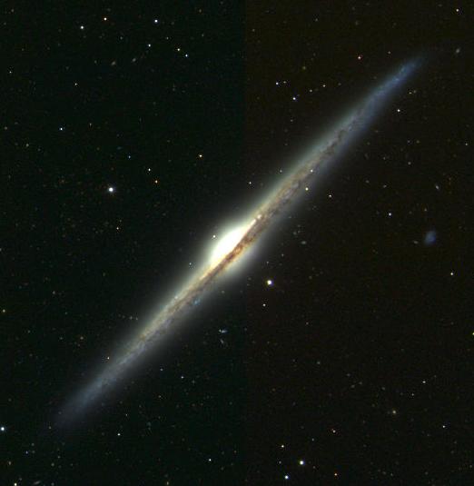 Spiral galaxies seen edge-on often show dark lanes of interstellar dust blocking light from the galaxy's stars, as in this image of the galaxy NGC 4565 from the Sloan Digital Sky Survey (SDSS-II). Spiral galaxies seen edge-on often show dark lanes of interstellar dust blocking light from the galaxy's stars, as in this image of the galaxy NGC 4565 from the Sloan Digital Sky Survey (SDSS-II).