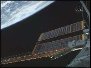 Screen shot from NASA TV during the solar array deployment. Credit: NASA TV Screen shot from NASA TV during the solar array deployment. Credit: NASA TV