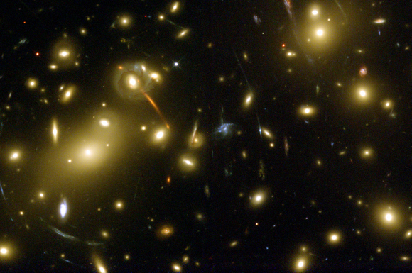 The HST WFPC2 image of gravitational lensing in the galaxy cluster Abell 2218, indicating the presence of large amount of dark matter (credit Andrew Fruchter at STScI).