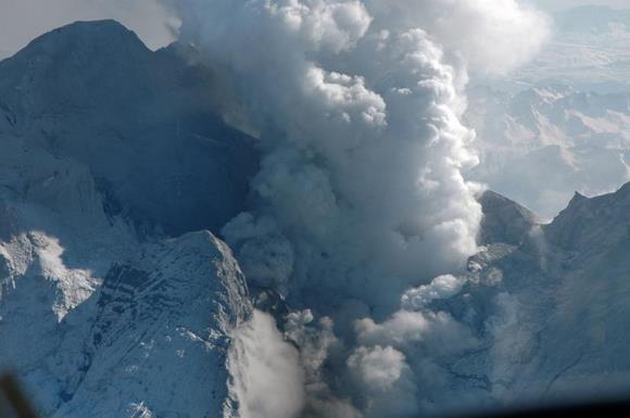 View north into the summit crater of Redoubt volcano where recent eruptions have removed a significant portion of the glacial ice. A remnant shelf of ice remains on the west (right) side of crater, and in this view, fumaroles are rising from near the ice/wall-rock contact. Image Creator: Payne, Allison View north into the summit crater of Redoubt volcano where recent eruptions have removed a significant portion of the glacial ice. A remnant shelf of ice remains on the west (right) side of crater, and in this view, fumaroles are rising from near the ice/wall-rock contact. Image Creator: Payne, Allison