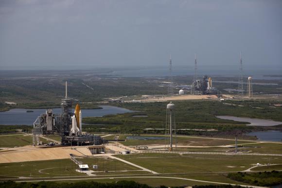 Space shuttle Atlantis (left) and Endeavour stand on Launch Pads 39A and 39B at NASA's Kennedy Space Center in Florida. This is likely the last time this will happen. Image Credit: NASA Space shuttle Atlantis (left) and Endeavour stand on Launch Pads 39A and 39B at NASA's Kennedy Space Center in Florida. This is likely the last time this will happen. Image Credit: NASA