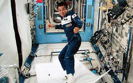 Japanese astronaut Koichi Wakata demonstrating a 'magical flying carpet' Photo: GETTY 