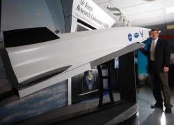 Charlie Brink, manager of the Air Force's X-51 "Waverider" scramjet research project stands with a scale model of the hypersonic aircraft. Credit: Ty Greenlees Dayton Daily News