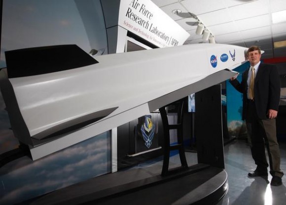 Charlie Brink, manager of the Air Force's X-51 "Waverider" scramjet research project stands with a scale model of the hypersonic aircraft. Credit: Ty Greenlees Dayton Daily News Charlie Brink, manager of the Air Force's X-51 "Waverider" scramjet research project stands with a scale model of the hypersonic aircraft. Credit: Ty Greenlees Dayton Daily News