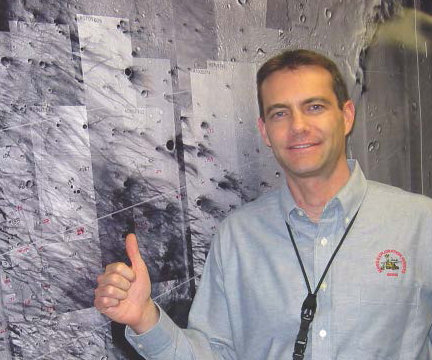 Chris Potts points to Gusev Crater on Mars on January 4, 2004, after the MER navigation team landed the Spirit rover on Mars with unprecedented accuracy. Photo courtesy Chris Potts