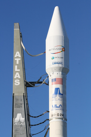 The Atlas 5 will orbit the commercial Intelsat 14 communications satellite. This photo shows upper portion of rocket and umbilical cord connections leading from mobile launch platform to the decaled 4 meter wide white colored payload fairing and Centaur upper stage. The flight is designated as tail number AV-024. Credit: Ken Kremer