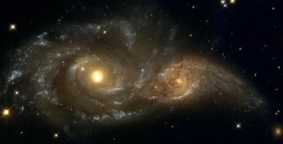 A Grazing Encounter Between Two Spiral Galaxies (NGC 2207 and IC2163) A Grazing Encounter Between Two Spiral Galaxies (NGC 2207 and IC2163). Credit: HubbleSite