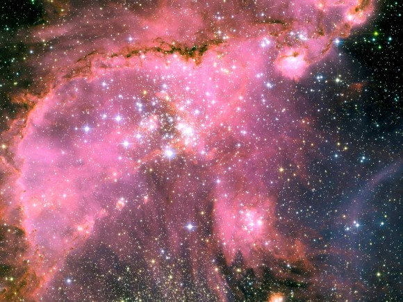 Young Stars Sculpt Gas with Powerful Outflows in the Small Magellanic Cloud Young Stars Sculpt Gas with Powerful Outflows in the Small Magellanic Cloud