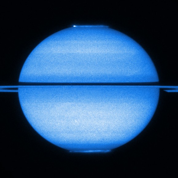 Hubble's view of Saturn with a double view of its fluttering aurorae. Credit: NASA, ESA and Jonathan Nichols (University of Leicester)