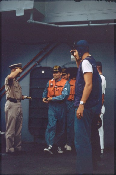 Haise and Lovell emerge on deck for helicopter ride to American Samoa. Image courtesy Robert Gillette.