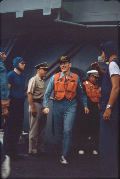 Swigert strides on deck moments later for helicopter ride to American Samoa. Image courtesy Robert Gillette.