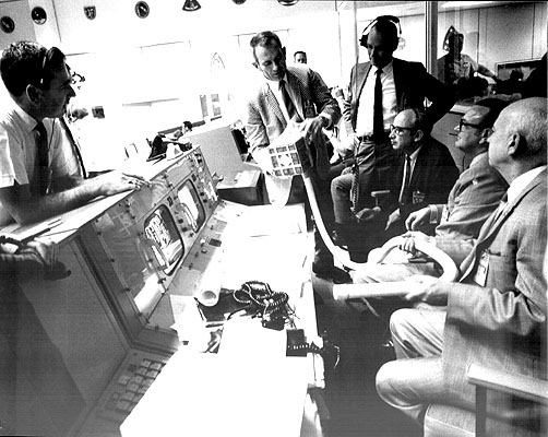 The "fix" for the lithium hydroxide canister is discussed at NASA Mission Control prior to having the astronauts implement the procedure in space. Credit: NASA