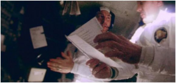 Screenshot from Apollo footage of Jim Lovell and Jack Swigert. Credit: NASA