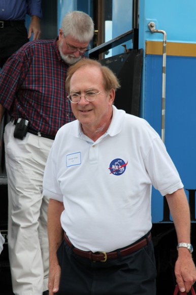 George Diller, the 'voice' of NASA TV, disembarks from the train carrying the SRB segments. Credit: Alan Walters (awaltersphoto.com) for Universe Today.
