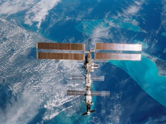 The International Space Station (ISS) is backdropped over Miami, Florida