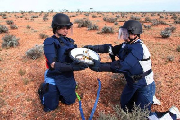 The recovery team handles the heat sheild for the Hayabusa sample return capsule. Credit: JAXA, Hayabusa Twitter feed.