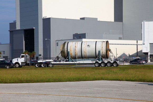 Used SRB sections drive past while ET-138 is being unloaded at KSC. Credit: Alan Walters (awaltersphoto.com) for Universe Today