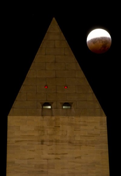 The Washington Monument is seen as the full moon is shadowed by the Earth during a total lunar eclipse on the arrival of the winter solstice, Tuesday, December 21, 2010 in Washington. From beginning to end, the eclipse lasted about three hours and twenty-eight minutes. Photo Credit: (NASA/Bill Ingalls)