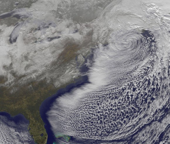 On Monday, Dec. 27 at 1731 UTC (12:31 p.m. EST) the GOES-13 satellite captured this visible image of the powerful low pressure system that brought snows from Georgia to Maine along the US east coast. Some of the snowfall can be seen over South and North Carolina, Virginia, Maryland, Delaware, eastern Pennsylvania, New Jersey and southeastern New York. The clouds of the low obscure New England in the image. Credit: NOAA/NASA GOES Project