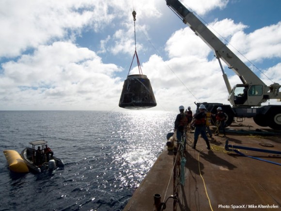 The SpaceX crew brought Dragon back to the barge where the crane lifted it from the water. Credit: SpaceX/Mike Althofen