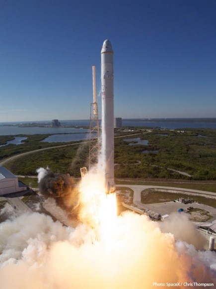 The Falcon 9 launch vehicle carrying the Dragon spacecraft, climbing from the launch pad. Credit: SpaceX/Chris Thompson