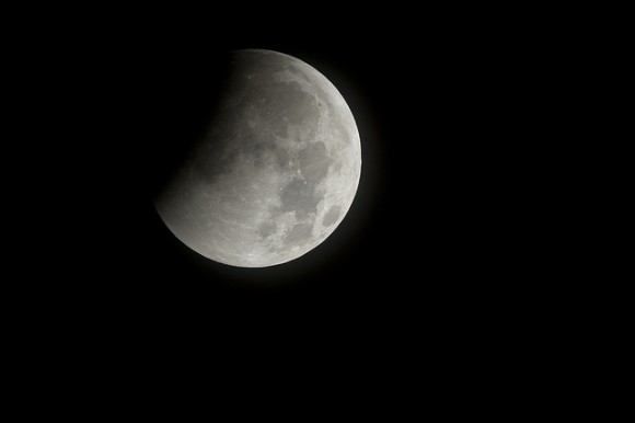 A total lunar eclipse begins as the full moon is shadowed by the Earth on the arrival of the winter solstice, Tuesday, December 21, 2010 in Arlington, VA. Photo Credit: (NASA/Bill Ingalls)