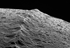 A closeup of Iapetus' ridge. In 2007, Cassini flew within a few thousand kilometers of Iapetus' surface to take this dramatic image. Credit: NASA/JPL/SSI