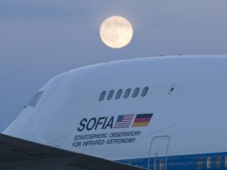 The Stratospheric Observatory for Infrared Astronomy, or SOFIA, 747SP basks in the light of a full moon shining over California’s Mojave Desert. NASA photographer Tom Tschida shot this telephoto image on October 22, 2010 NASA Photo / Tom Tschida