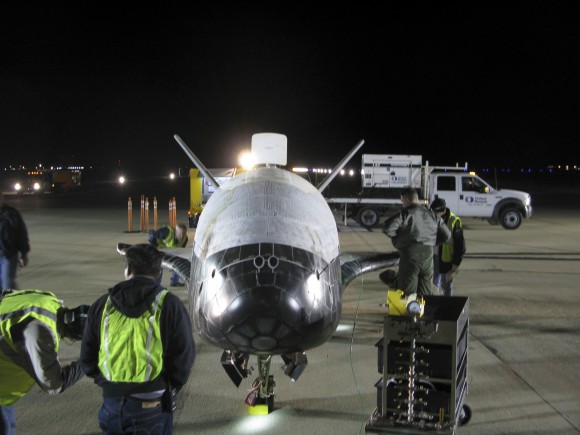 X-37B is shown here after landing at 1:16 a.m. Pacific time today, concluding its more than 220-day experimental test mission. Credit: Boeing