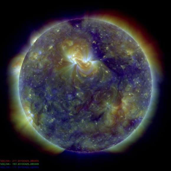 Multiwavelength extreme ultraviolet image of the Sun taken by the Solar Dynamics Observatory's Atmospheric Imaging Assembly. Colours represent different gas temperatures: ~800,000 Kelvin (blue), ~1.3 million K (green), and ~2 million K (red). New observations reveal jets of hot plasma propelled upwards from the region immediately above the Sun's surface. Image: Bart De Pontieu)