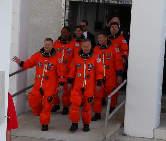 The STS-133 crew walks out to head to the launchpad. Credit: Alan Walters (awaltersphoto.com) for Universe Today.