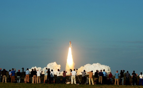 STS-133 launch as seen from the KSC press site. Credit: Jason Rhian