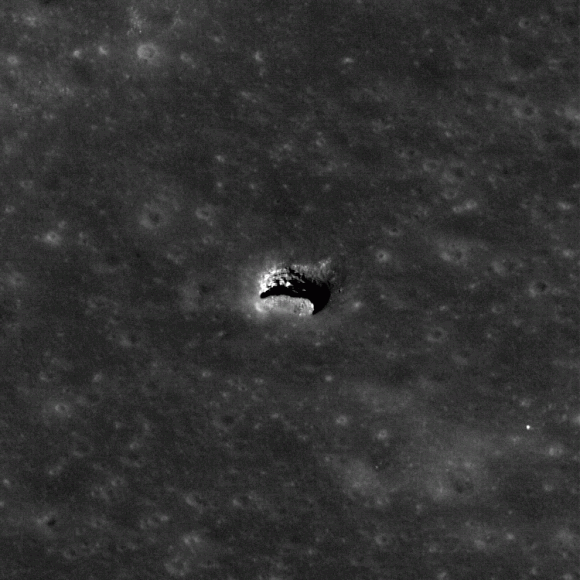 The LROC NAC acquired an oblique view of the Marius Hills pit with just the right angle to reveal an overhang, with a pit below, which is about 65 meters in diameter. Credit: NASA/GSFC/Arizona State University.