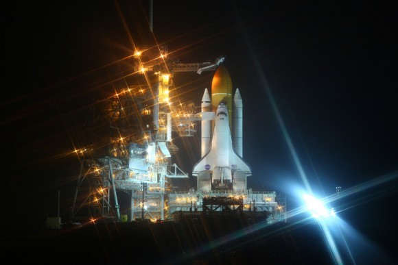 Discovery bathed in lights after the RSS was retracted on Feb. 23, 2011. Credit: Alan Walters (awaltersphoto.com) for Universe Today.