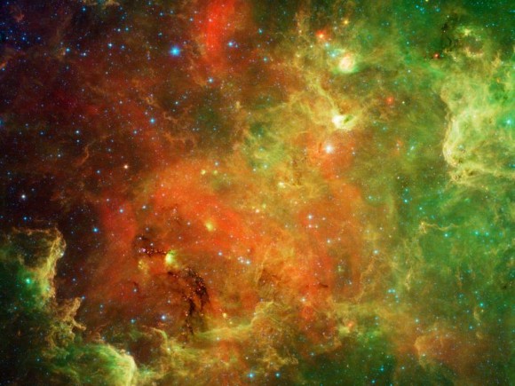 This swirling landscape of stars is known as the North American nebula. In visible light, the region resembles North America, but in this new infrared view from NASA's Spitzer Space Telescope, the continent disappears. Image credit: NASA/JPL-Caltech