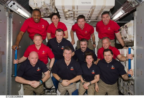 The crews from STS-133 and the ISS Expedition 26 in the newly installed Permanent Multipurpose Module. Credit: NASA