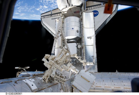 A view of the docked space shuttle Discovery during the STS-133 mission, along with and the Canadian-built robot Dextre, and other parts of the ISS. Credit: NASA