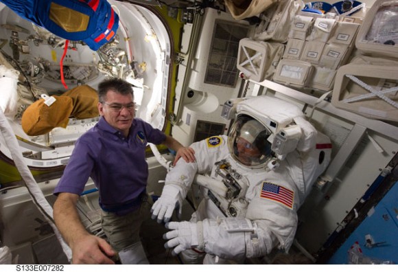 European Space Agency astronaut Paolo Nespoli (left), Expedition 26 flight engineer; and NASA astronaut Steve Bowen, STS-133 mission specialist, are pictured in the Quest airlock of the International Space Station as they prepare for the start of the mission's first spacewalk. Credit: NASA