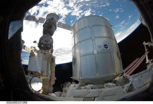 The newly-attached Permanent Multipurpose Module (PMM) and a docked Russian Soyuz spacecraft. Credit: NASA