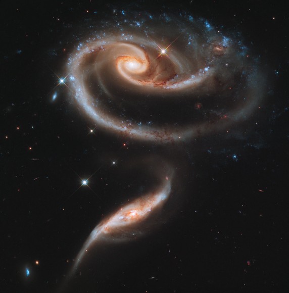 In celebration of the 21st anniversary of the Hubble Space Telescope’s deployment into space, astronomers pointed Hubble at Arp 273. Credit: NASA, ESA and the Hubble Heritage Team (STScI/AURA)