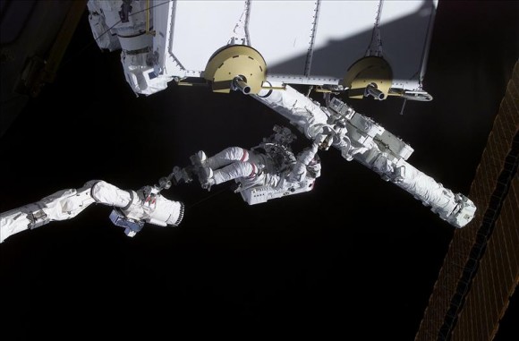 April 22, 2001 – History is made. Canadian Space Agency Astronaut Chris Hadfield, attached to Canadarm, installs the next-generation Canadarm2 to the International Space Station during Shuttle Mission STS-100. Credit: NASA