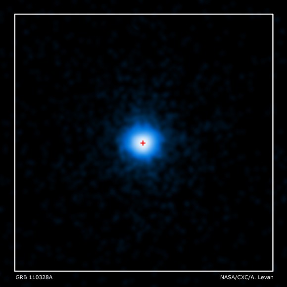 NASA's Chandra X-ray Observatory completed this four-hour exposure of GRB 110328A on April 4. The center of the X-ray source corresponds to the very center of the host galaxy imaged by Hubble (red cross). Credit: NASA/CXC/ Warwick/A. Levan