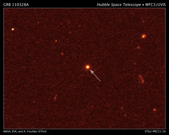 This is a visible-light image of GRB 110328A's host galaxy (arrow) taken on April 4 by the Hubble Space Telescope's Wide Field Camera 3. The galaxy is 3.8 billion light-years away. Credit: NASA/ESA/A. Fruchter (STScI)