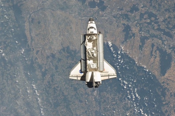 Endeavour approaches the International Space Station. Visible is the Alpha Magnetic Spectrometer in the payload bay. Credit: NASA